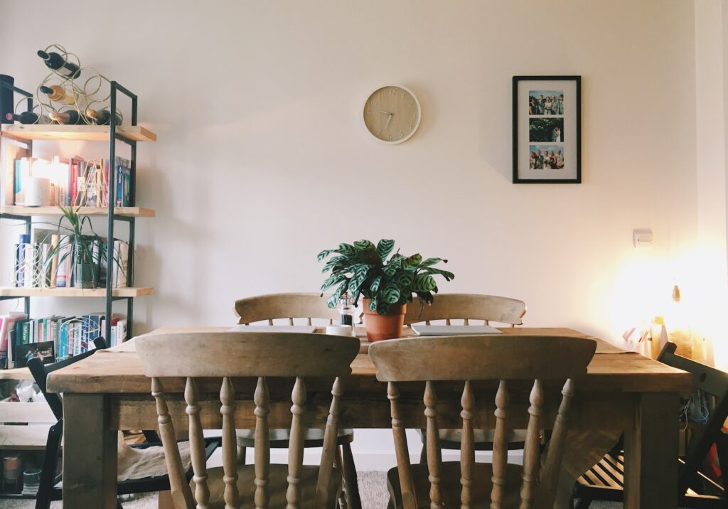 green plant on white ceramic pot on table